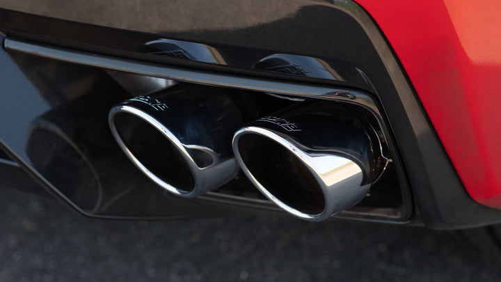 Close-up of Borla 140841 quad 4 inch round bright chrome tips on C8 Corvette Stingray