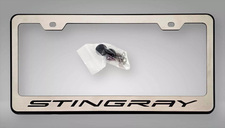 C8 Corvette STINGRAY license frame with a brushed face, black lettering and black perimeter