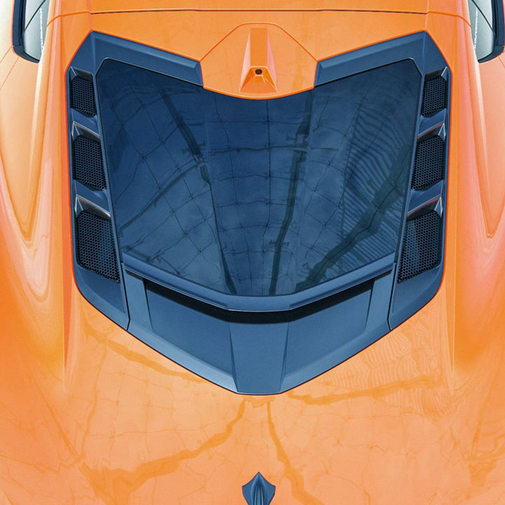 ACS Composite rear window spoiler on an orange narrow-body C8 Corvette, straight down on the rear glass and the window bezels