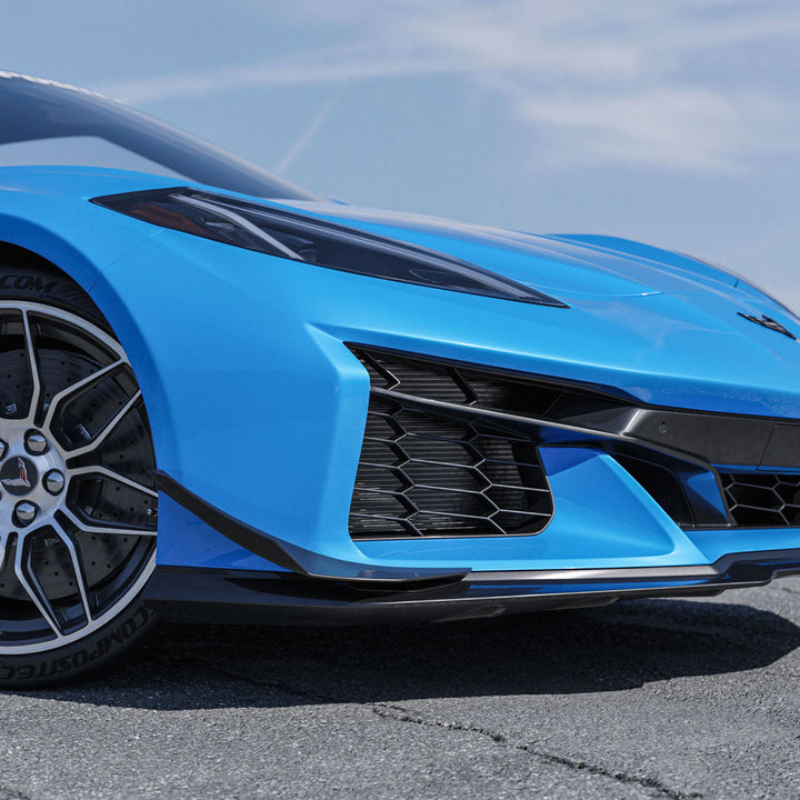 ACS Composite canard fitted to a blue widebody C8 Corvette, front corner below the headlamp and outboard of the splitter