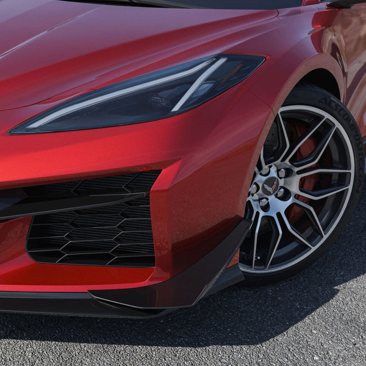 ACS Composite canard fitted to a red widebody C8 Corvette, shown at the splitter edge ahead of the front wheel
