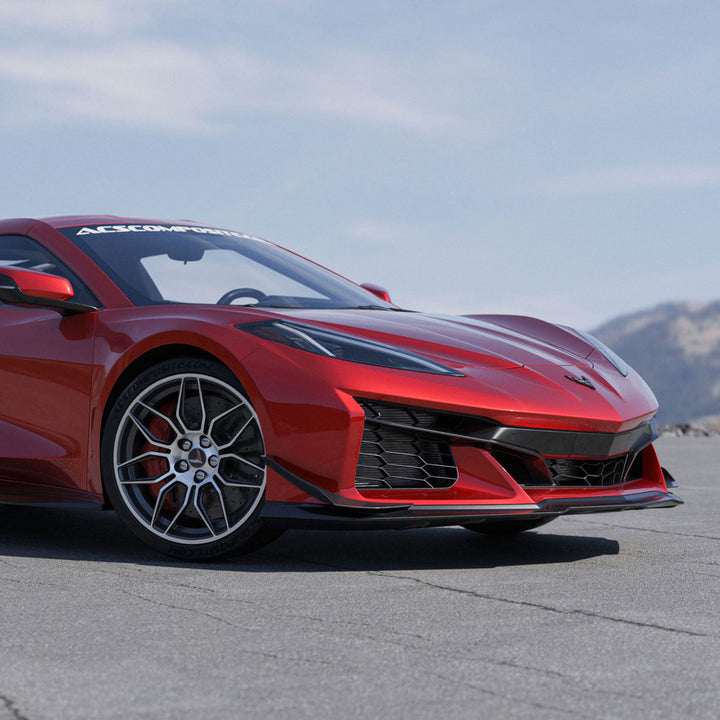 Red widebody C8 Corvette on tarmac from the front three quarter with ACS Composite canards fitted