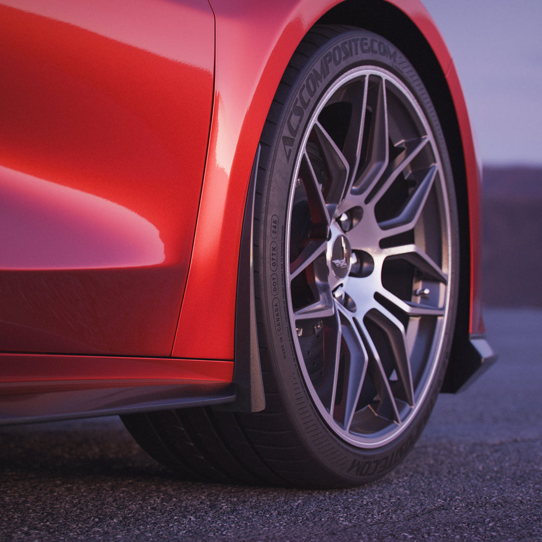 Front rock guards installed on 2024–2026 C8 Corvette E-Ray – ACS Composite Carbon Flash finish, OEM-style widebody fit