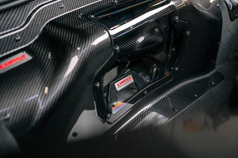 Close-up of CORSA 44012D carbon fiber air boxes and dual-path ducting for C8 Z06