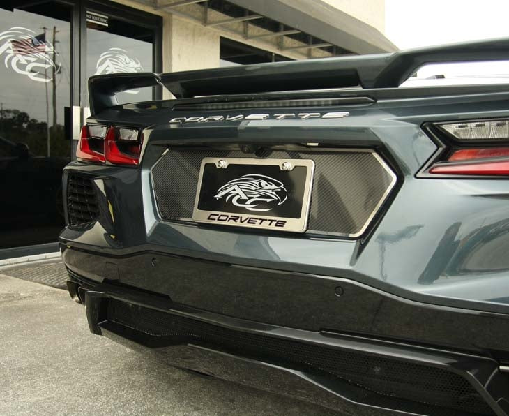 CORVETTE license frame with black lettering installed on the rear of a C8 Corvette