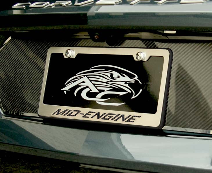 MID-ENGINE license frame with black lettering and black perimeter installed on a C8 Corvette