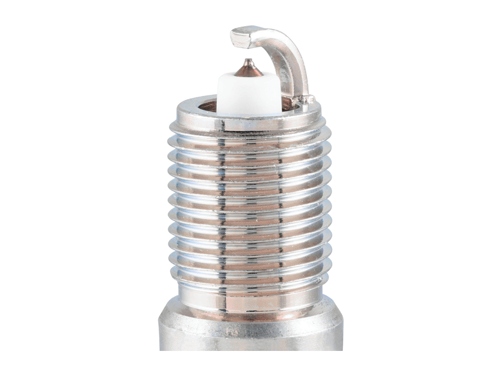 NGK G-Power platinum spark plug electrode close-up showing the center tip, curved ground electrode and threaded shell
