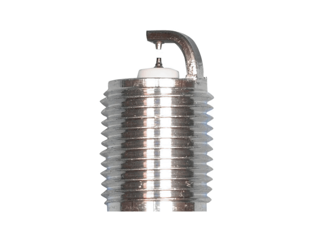 NGK Ruthenium HX spark plug electrode close-up with fine center tip, ground electrode and threaded shell against a white background