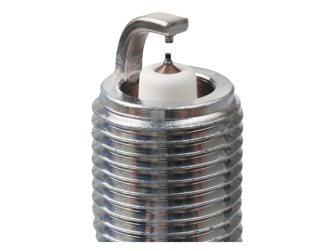 NGK Ruthenium HX spark plug electrode close-up showing the center tip, curved ground electrode and threaded shell