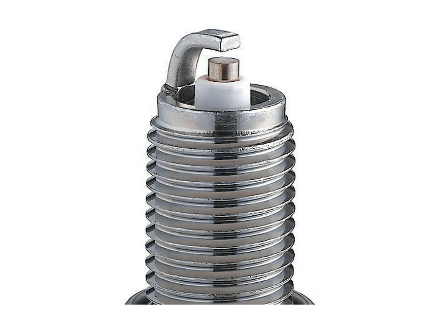 NGK spark plug family close-up showing the curved ground electrode, center firing tip, insulator nose and metal threads against white