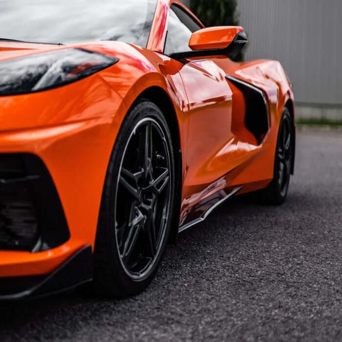 ACS Composite side skirts installed on C8 Corvette to protect rocker panels and create a lower, more aggressive stance