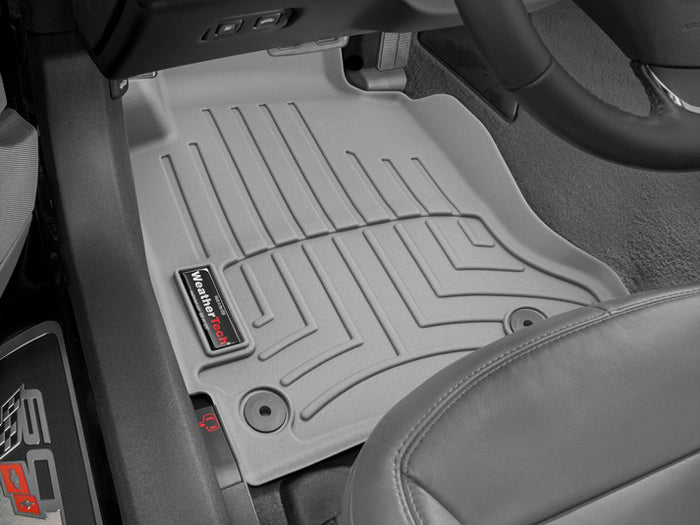 Grey WeatherTech FloorLiner installed in the driver-side footwell of a 2005–2013 C6 Corvette.